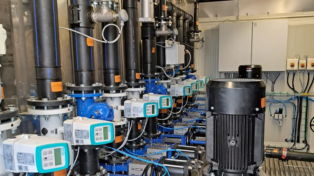Inside the pump container: collectors, flowmeters, valve actuators and a vertical multistage booster pump