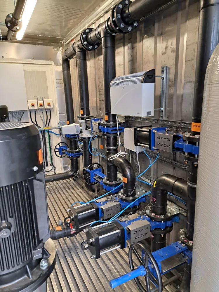 View along the pump container with collectors, valves and booster pumps